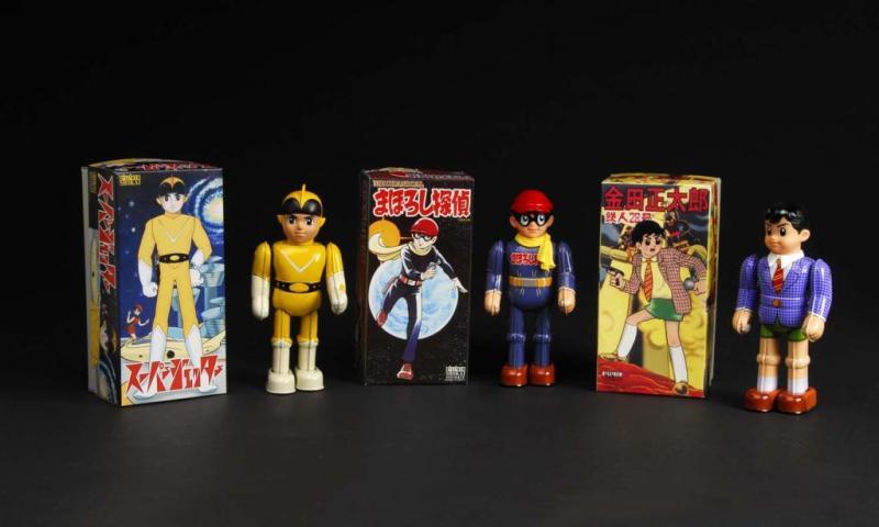 Appraisal: Lot of Tin Superhero Wind-Up Toys Description Japanese Made by