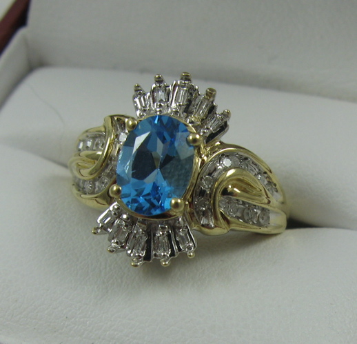 Appraisal: BLUE TOPAZ AND DIAMOND RING K white and yellow gold