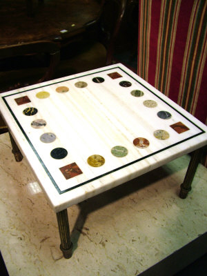 Appraisal: A specimen marble topped coffee table th century the square