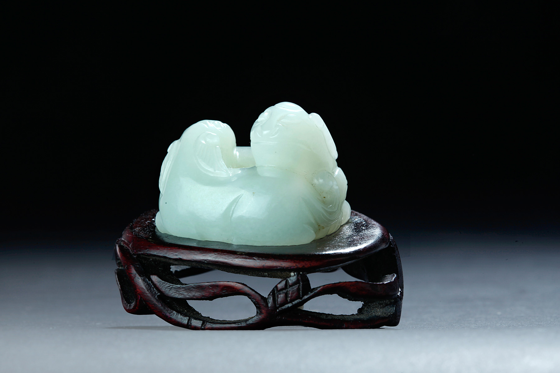 Appraisal: CHINESE MUTTON FAT WHITE JADE CARVING OF HUANS Late Qing