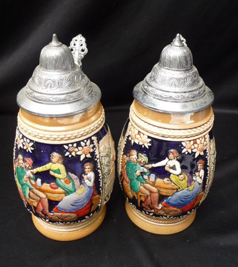 Appraisal: A pair of German beer steins with pewter lids colbalt