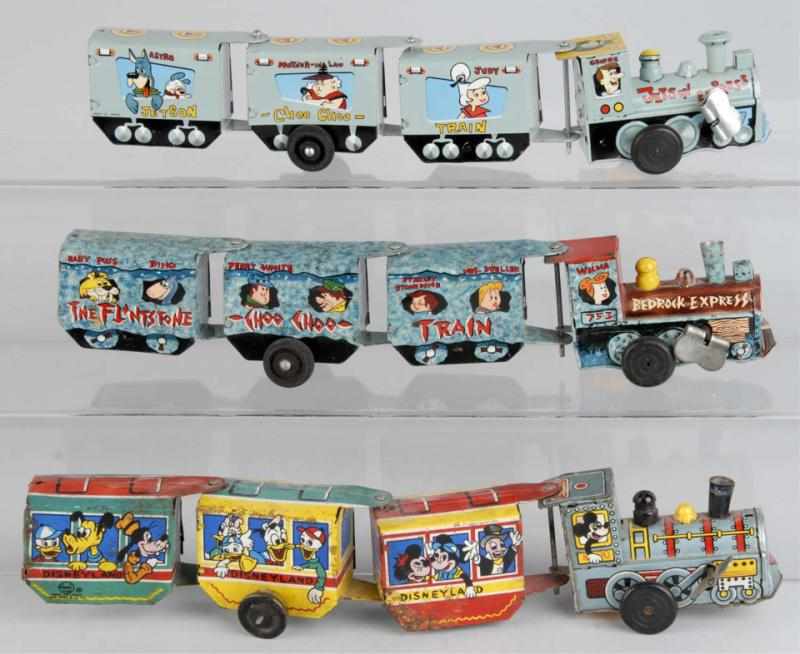 Appraisal: Lot of Tin Marx Character Train Wind-Up Toys Description American