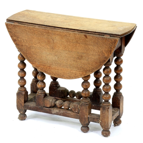 Appraisal: A miniature oak gateleg table th early th c in