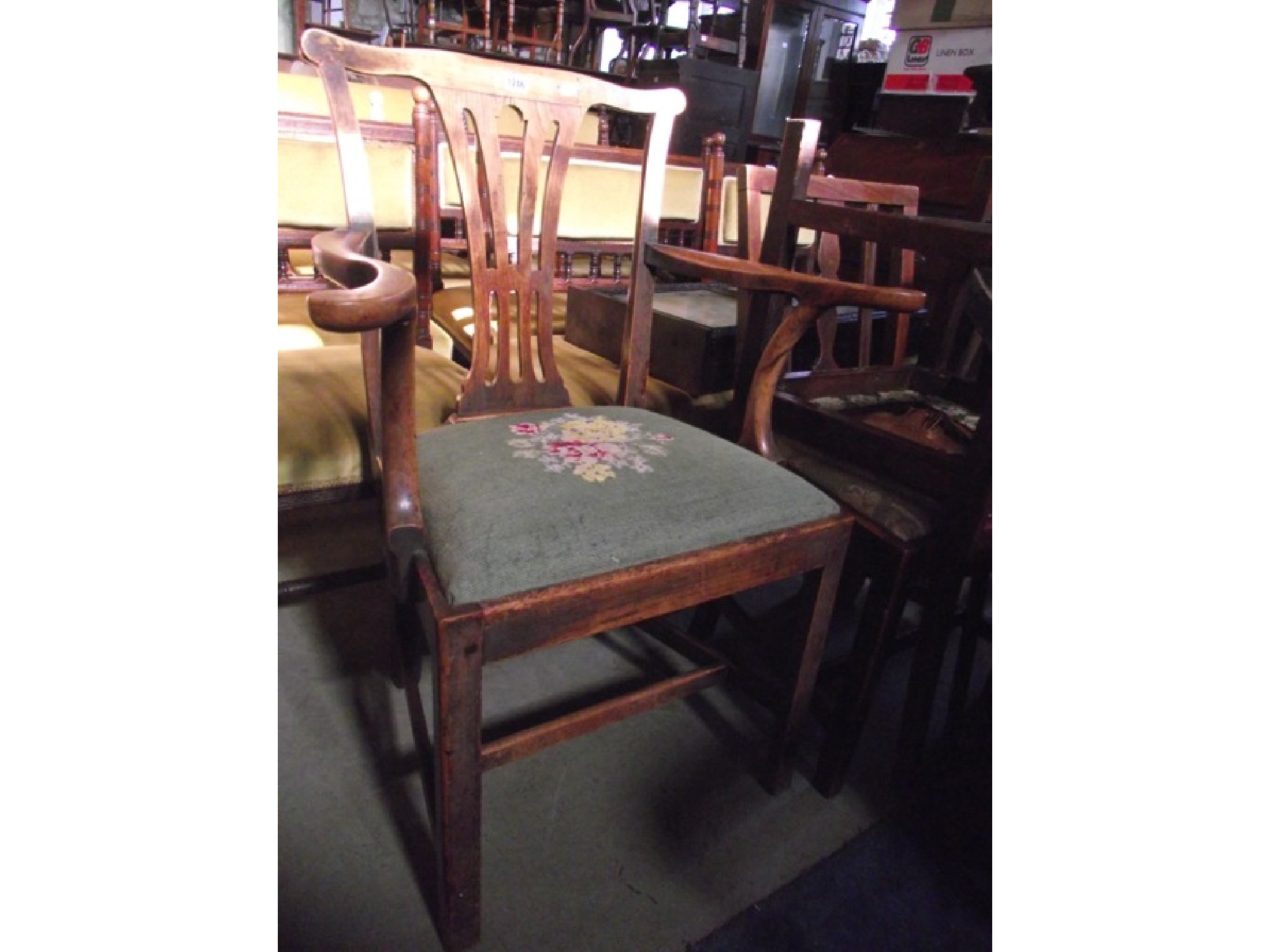 Appraisal: A Georgian Chippendale style open elbow chair with central pierced