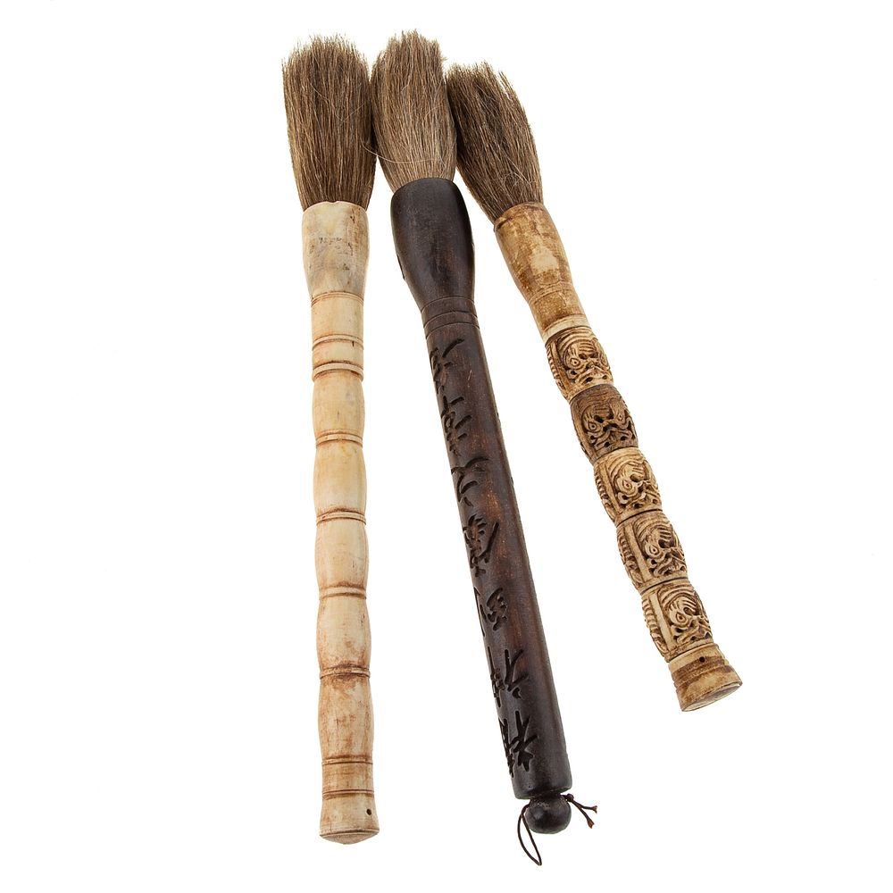 Appraisal: Three Asian Calligraphy Brushes Includes brush with carved hardwood handle