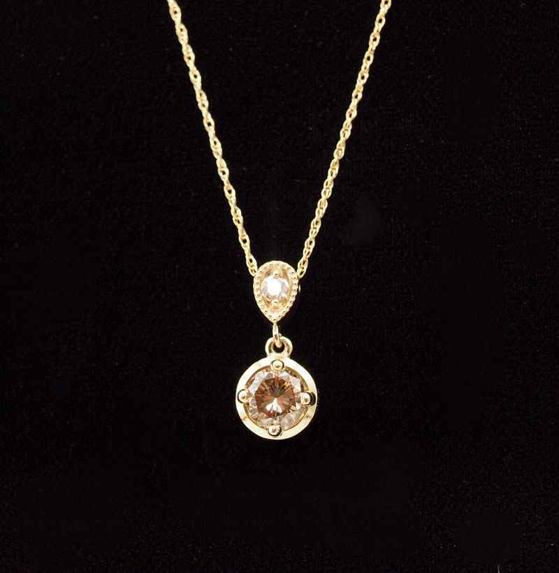 Appraisal: CHOCOLATE DIAMOND PENDANT K yellow gold pendant necklace contains one