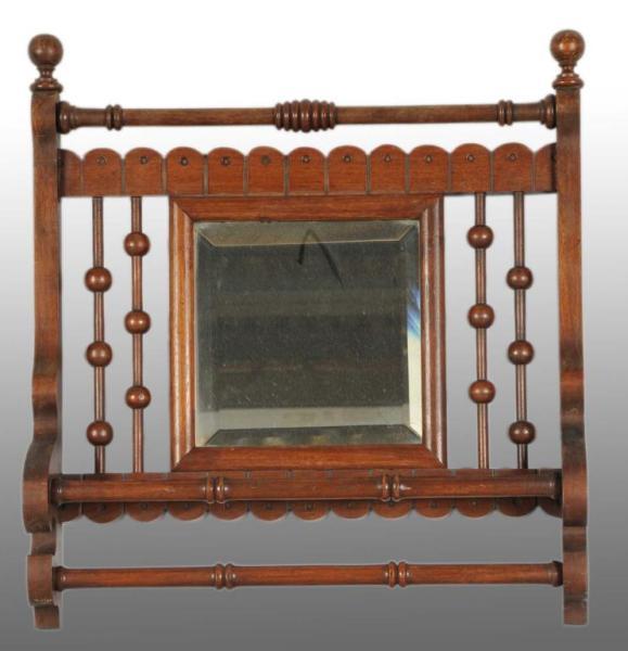 Appraisal: Victorian Towel Holder Mirror Description Walnut with two towel bars