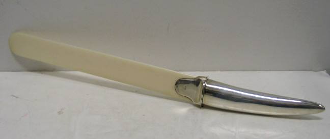 Appraisal: ENGLISH SILVER AND IVORY PAGE TURNER Birmingham silver horn-form handle