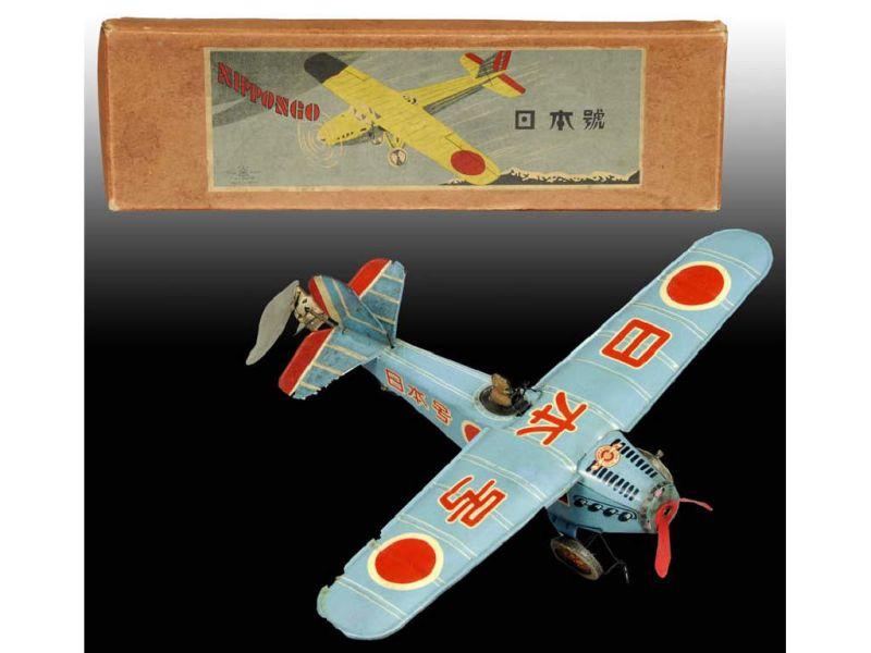 Appraisal: Pre-War Japanese Nippongo Tin Wind-Up Airplane wit Description Plane ''