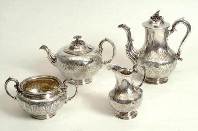 Appraisal: A VICTORIAN FOUR PIECE TEA SET of circular form with