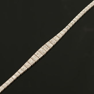 Appraisal: An Art Deco diamond bracelet The articulated tapered square panels