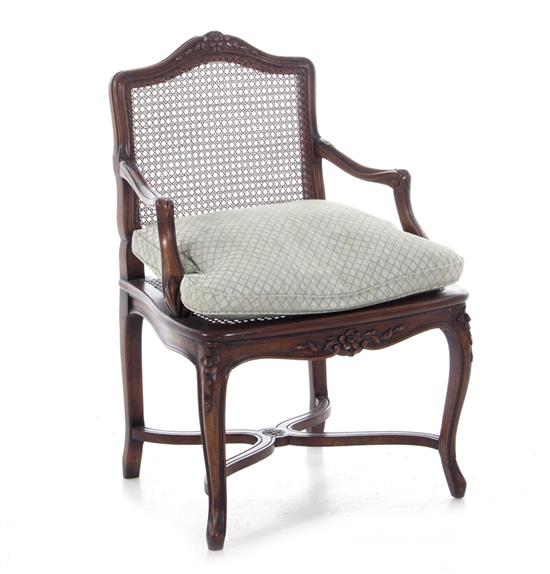 Appraisal: Louis XV style caned and carved fruitwood armchair BH SH