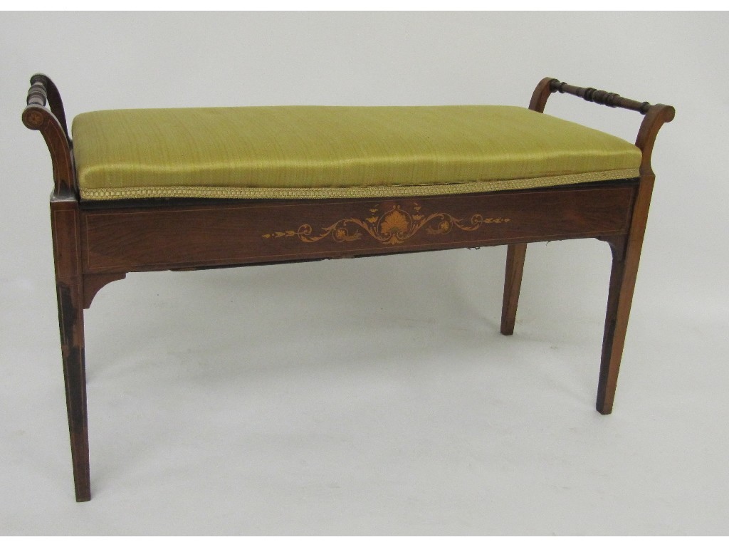 Appraisal: An Edwardian rosewood duet piano stool richly decorated with a