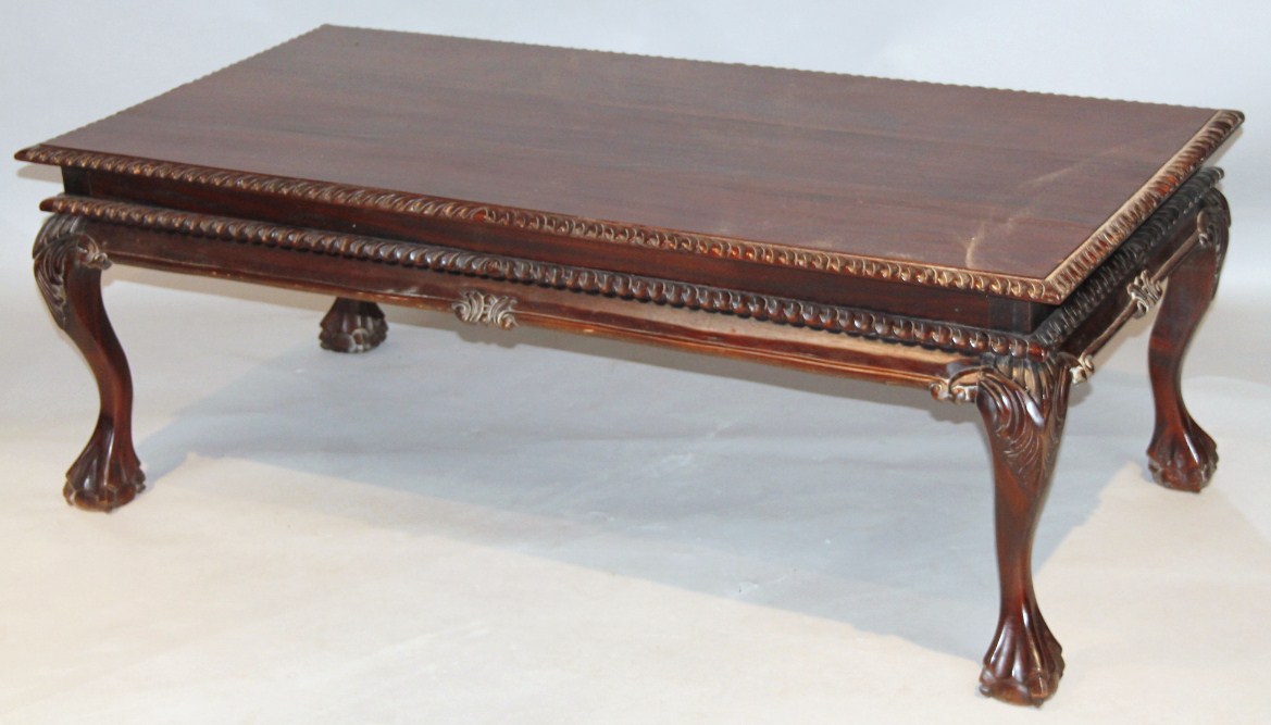 Appraisal: A thC mahogany finish coffee table of rectangular outline with