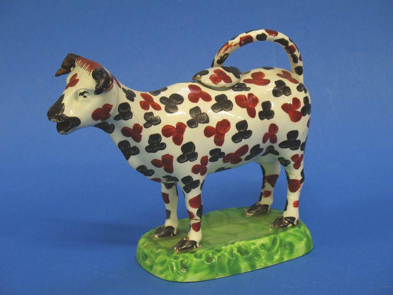 Appraisal: A POTTERY COW CREAMER late th early th century the