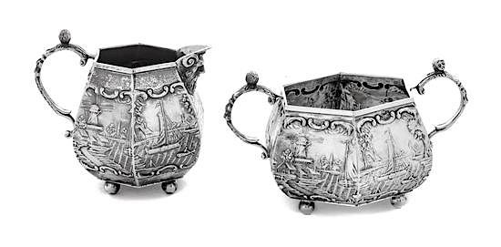 Appraisal: A Dutch Silver Creamer and Sugar Set each decorated with