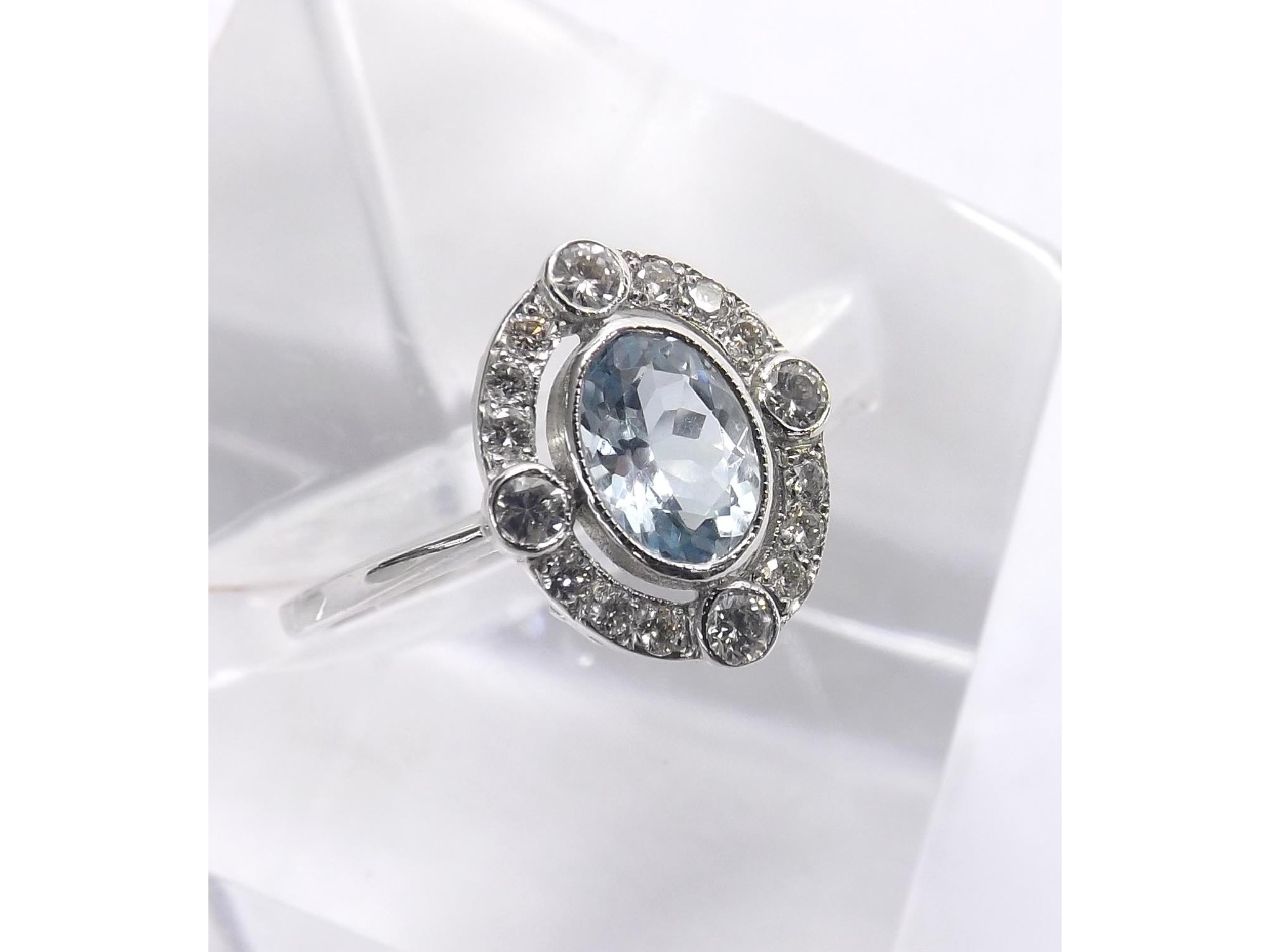 Appraisal: Aquamarine and diamond oval dress cluster ring in k white