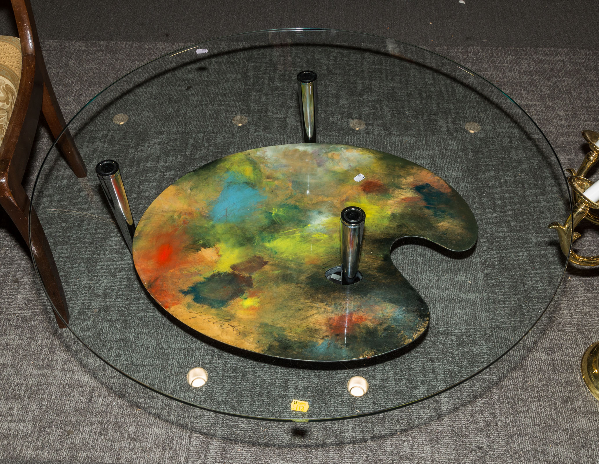 Appraisal: MODERN STYLE GLASS STEEL COFFEE TABLE With artist palette shaped