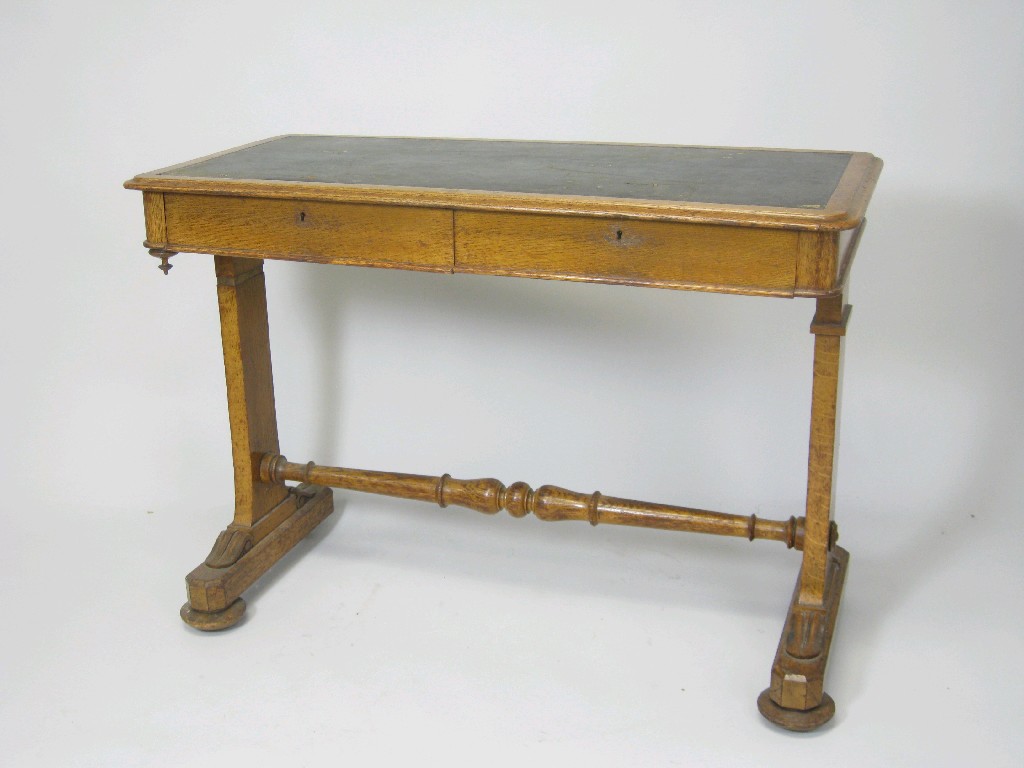 Appraisal: A Victorian oak Library Desk with inset top fitted two