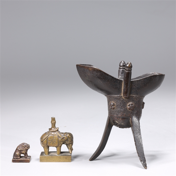 Appraisal: Grouping of two Chinese bronze seals together with bronze auchastic