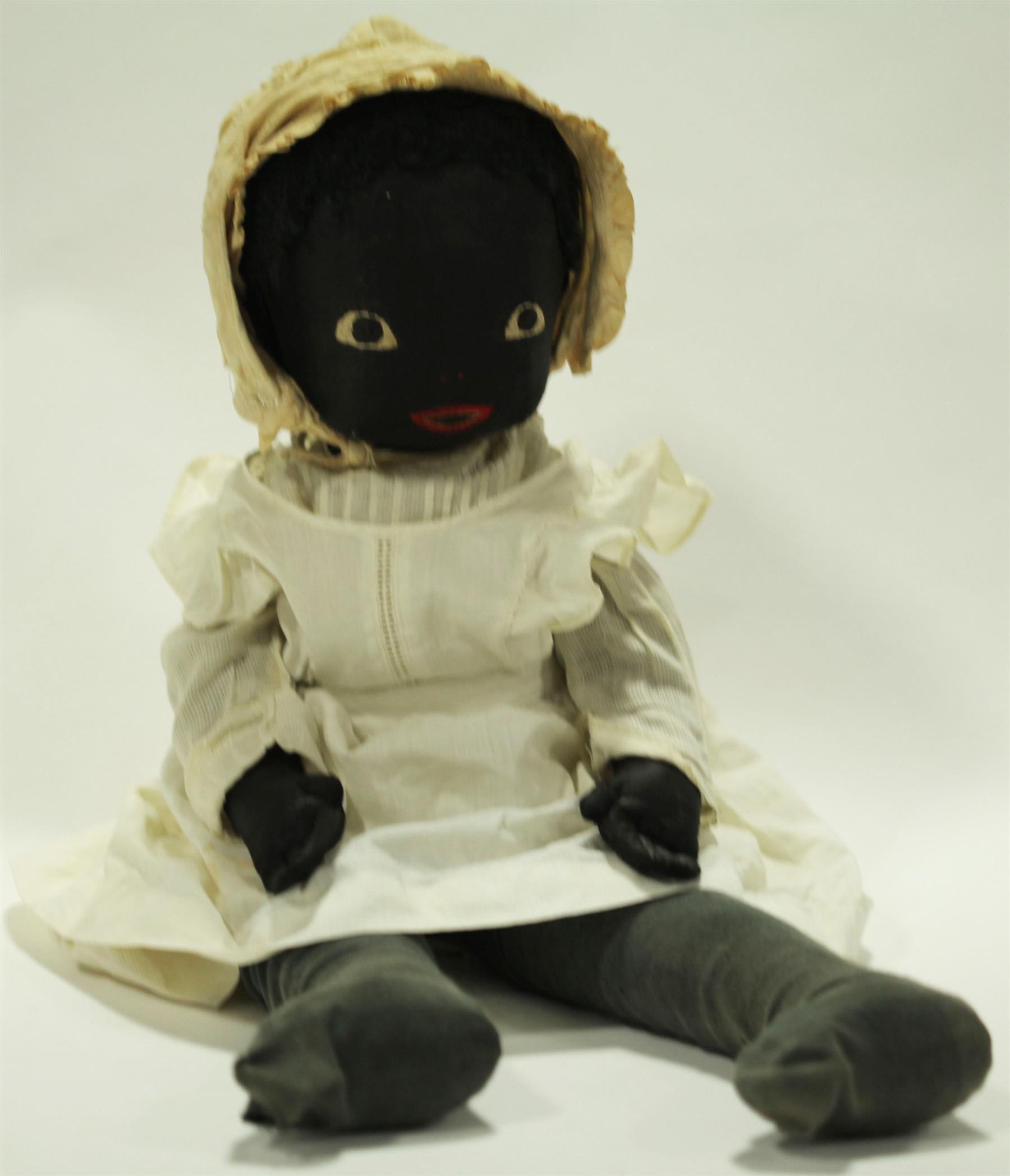 Appraisal: VERY LARGE BLACK CLOTH DOLL WITH STITCHED FACE This late