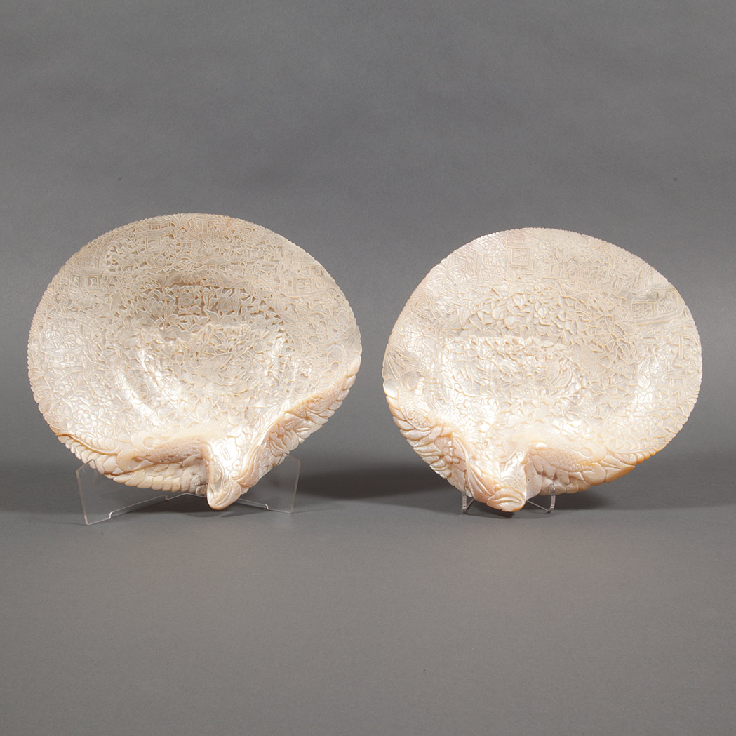 Appraisal: Pair of Chinese Carved Abalone Shells Each carved in relief