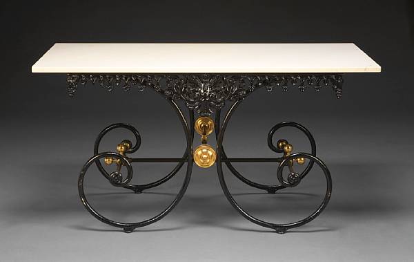 Appraisal: A black painted wrought iron and brass baker s table