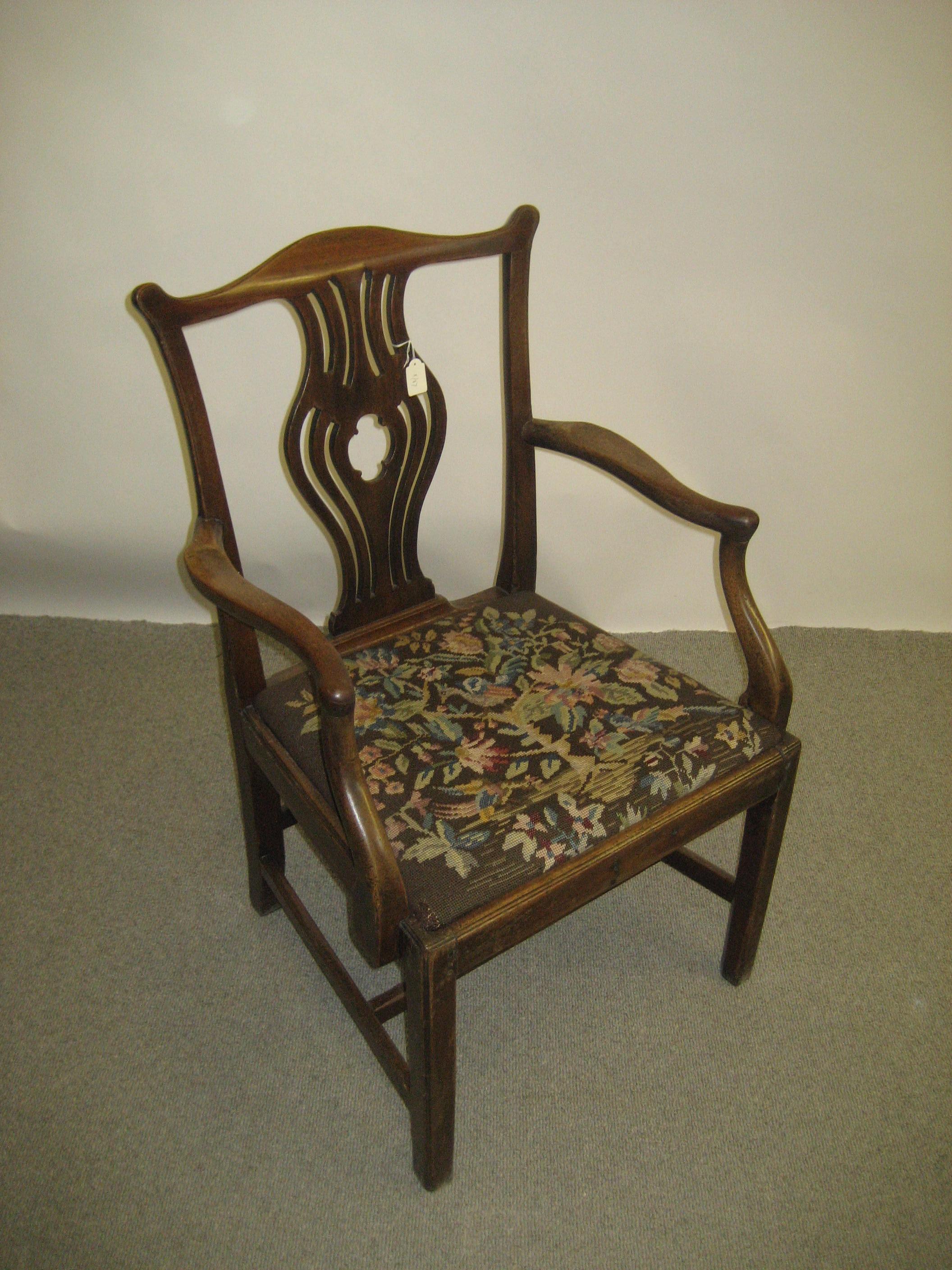 Appraisal: A GEORGIAN MAHOGANY ELBOW CHAIR late th century the arched