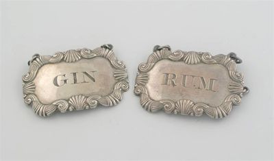 Appraisal: A pair of George III Sheffield-made wine labels with raised