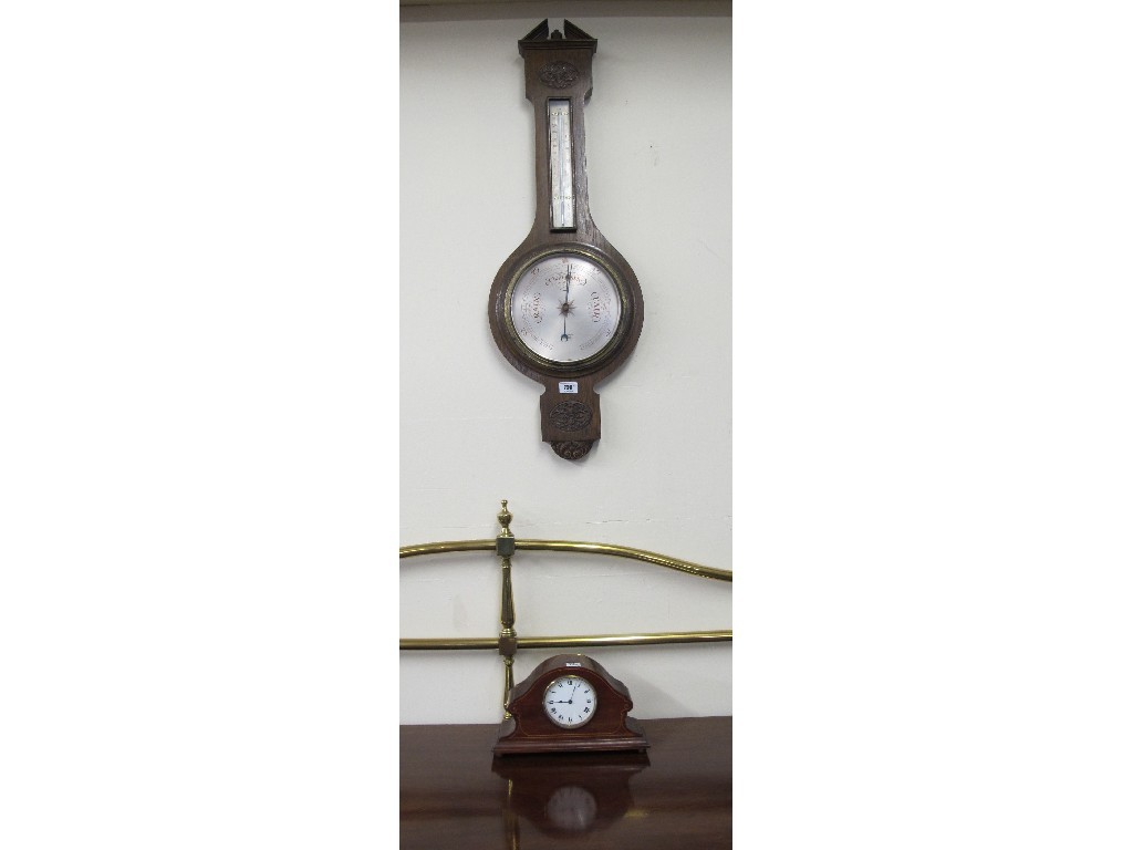 Appraisal: An Edwardian mahogany inlaid mantel clock and an oak wall