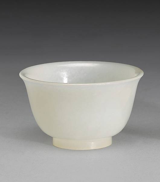 Appraisal: A miniature white jade bowl Late Qing Dynasty Of inverted