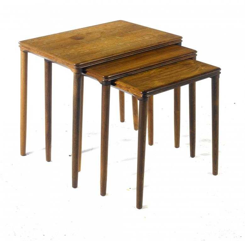 Appraisal: A DANISH ROSEWOOD NEST OF THREE TABLES the moulded oblong