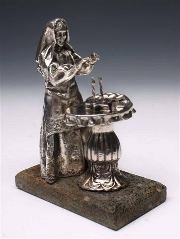 Appraisal: A JUDAICA STANDARD SILVER SYMBOLIC FIGURE of a hooded woman