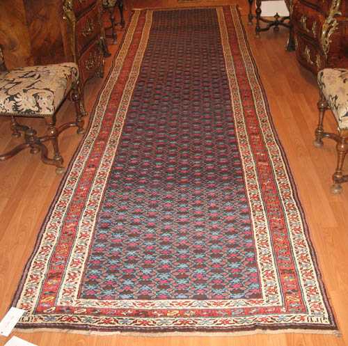 Appraisal: CAUCASIAN RUG old Dark central field with small stylised flowers