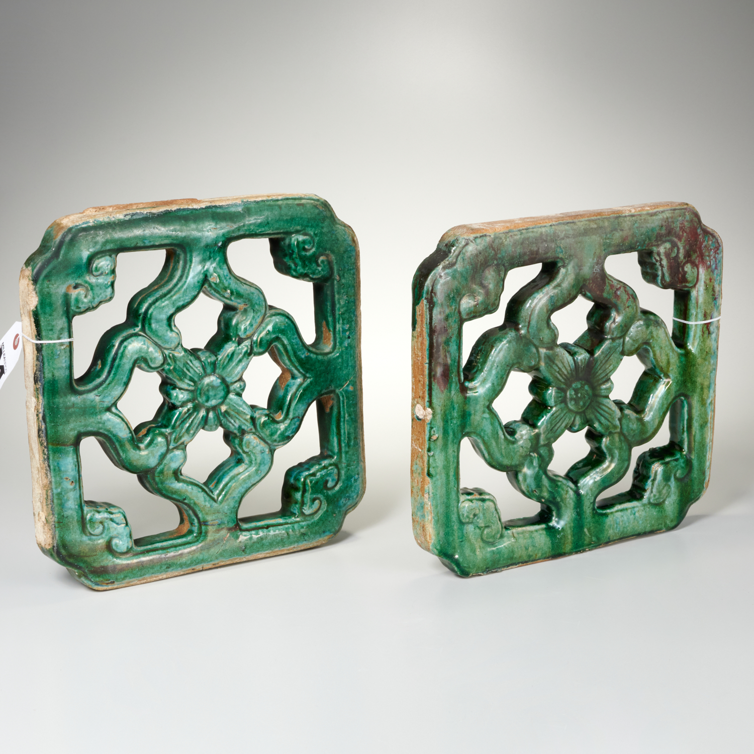 Appraisal: PAIR CHINESE GREEN GLAZED ARCHITECTURAL TILES th th c pair