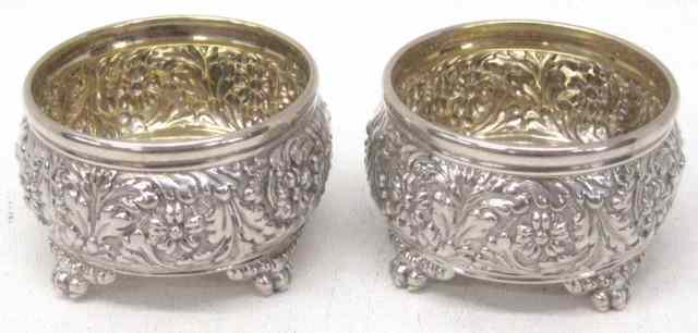 Appraisal: PAIR TIFFANY CO STERLING SILVER MASTER SALTS repousse pattern footed