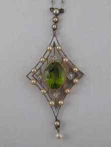 Appraisal: A fine Edwardian peridot pearl and diamond pendant set in