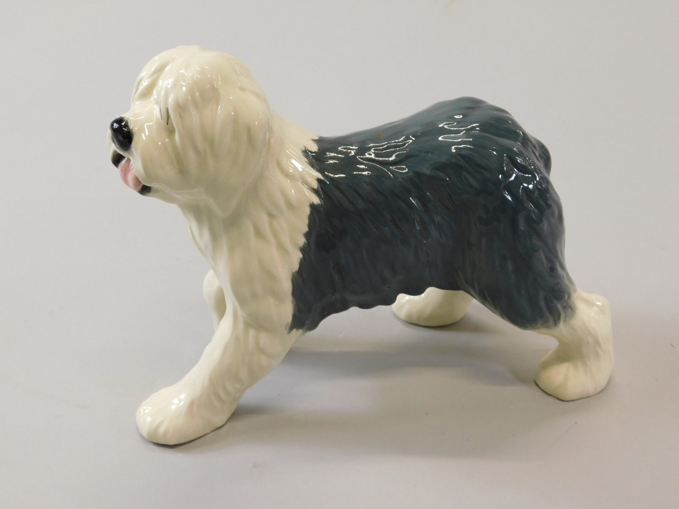 Appraisal: A modern Beswick Old English Sheep dog walking D gloss