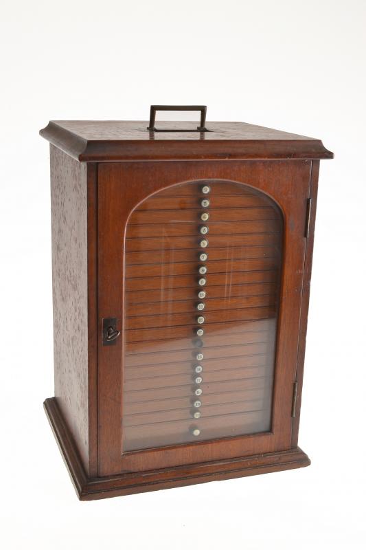 Appraisal: A COLLECTOR'S SPECIMEN CABINET glazed door drawers with ivory inset