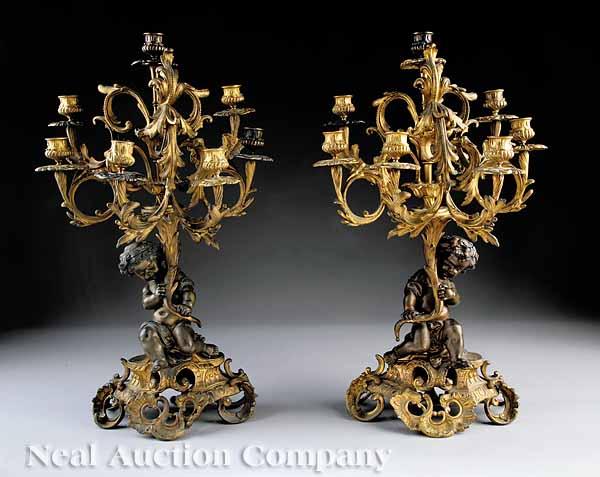 Appraisal: A Pair of French Gilt Bronze Seven-Light Figural Candelabra c