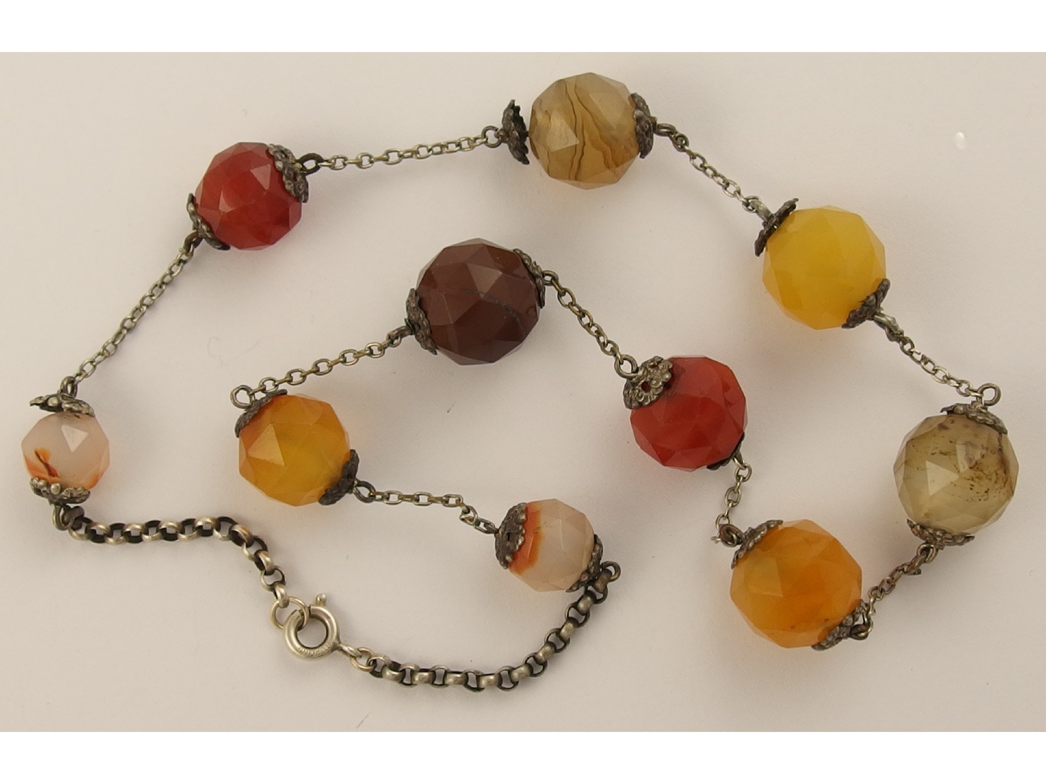 Appraisal: An unusual Scottish agate bead necklace the round facet cut