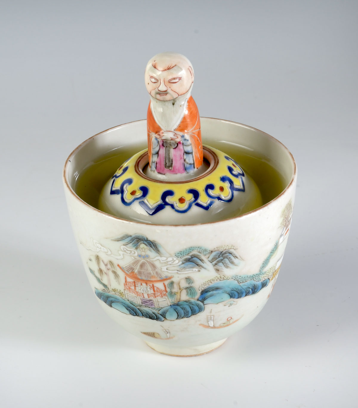 Appraisal: CHINESE PORCELAIN FAMILLE ROSE SURPRISE CUP Having a finely enameled