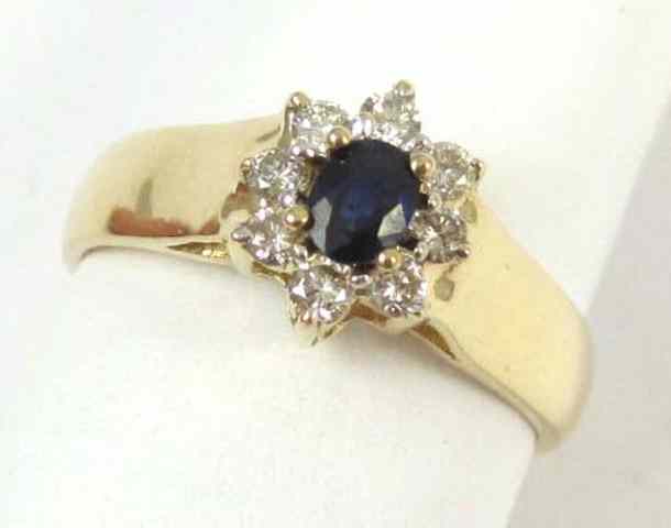 Appraisal: SAPPHIRE DIAMOND AND FOURTEEN KARAT GOLD RING eight round-cut diamonds