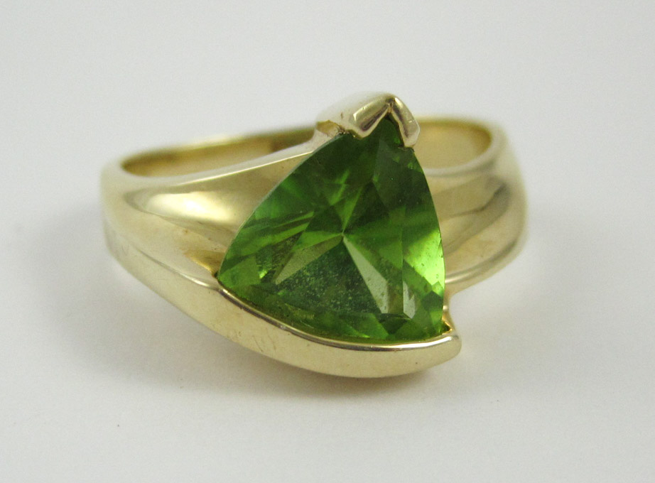 Appraisal: PERIDOT AND FOURTEEN KARAT GOLD RING set with a single