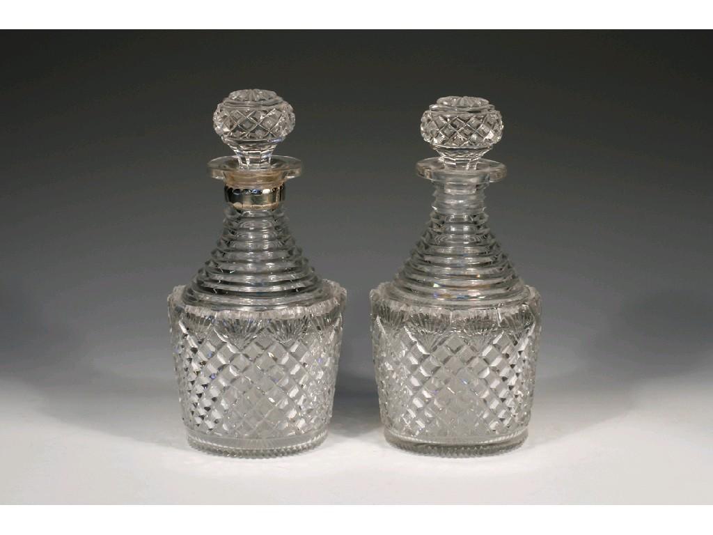 Appraisal: A PAIR OF REGENCY HOBNAIL-CUT GLASS DECANTERS with step-cut shoulders