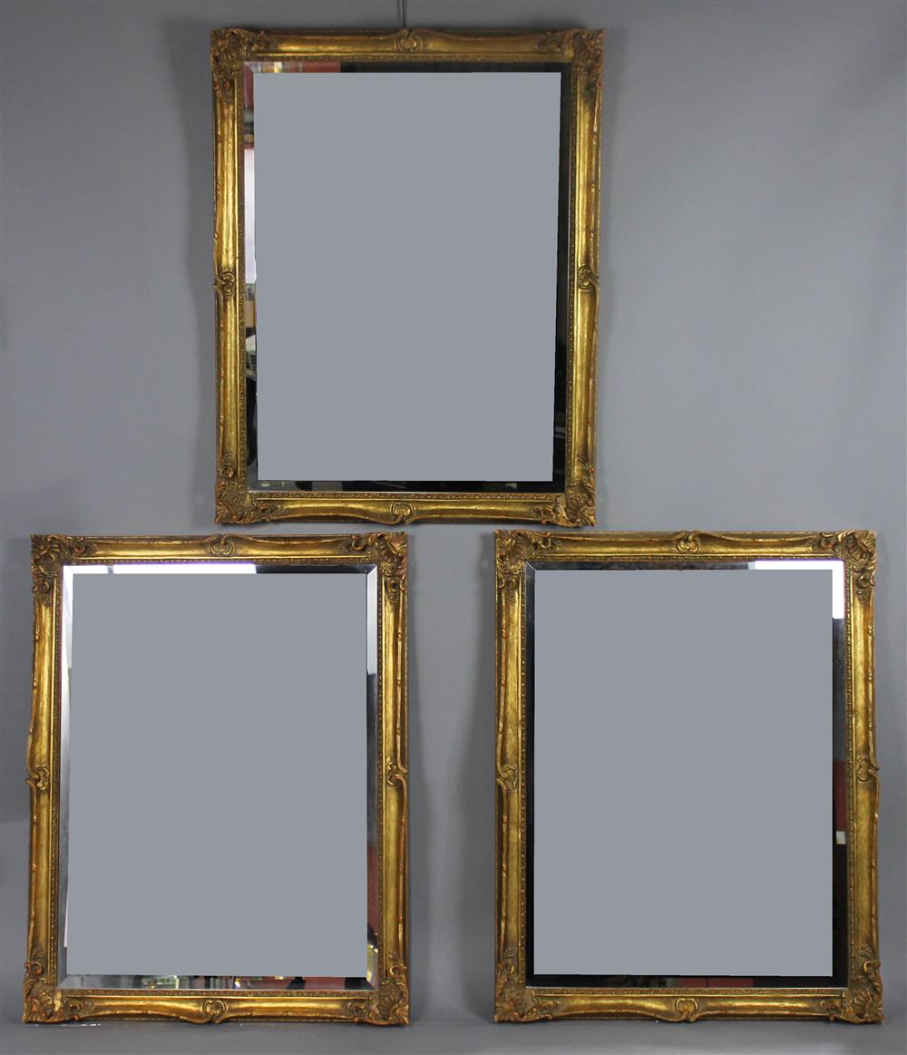 Appraisal: SET OF THREE GILT AND CARVED MIRRORS each with a