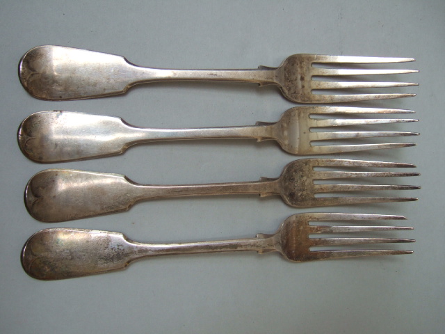 Appraisal: Four silver fiddle pattern table forks crest and monogram engraved