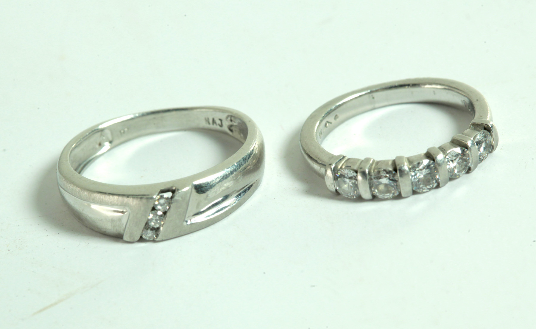 Appraisal: PAIR OF PLATINUM AND DIAMOND WEDDING BANDS American st century