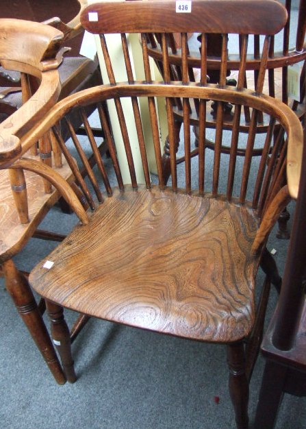 Appraisal: A th century low comb back Windsor armchair in beech