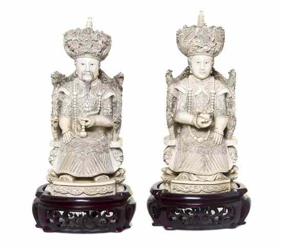 Appraisal: A Pair of Carved Ivory Figures depicting an emperor and